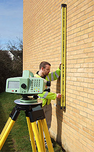 Picture of technician performing precise level monitoring survey